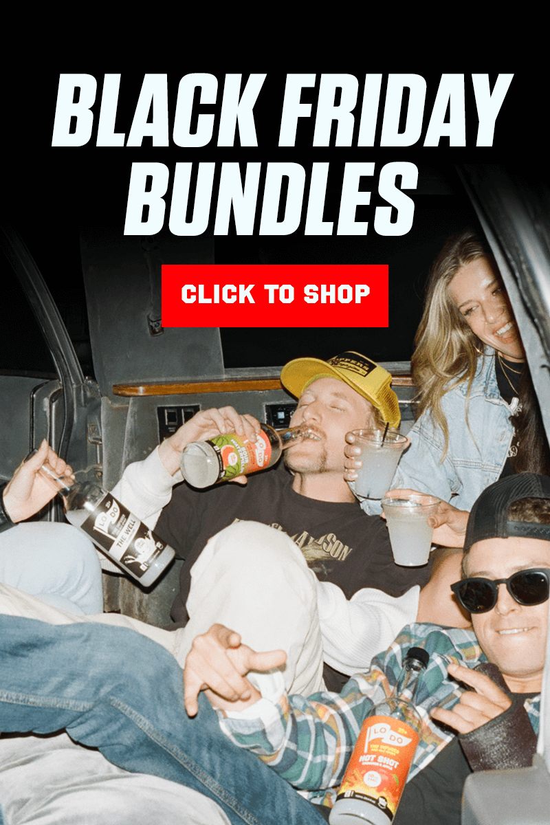 A woman pouring a beverage into a man's mouth with the text 