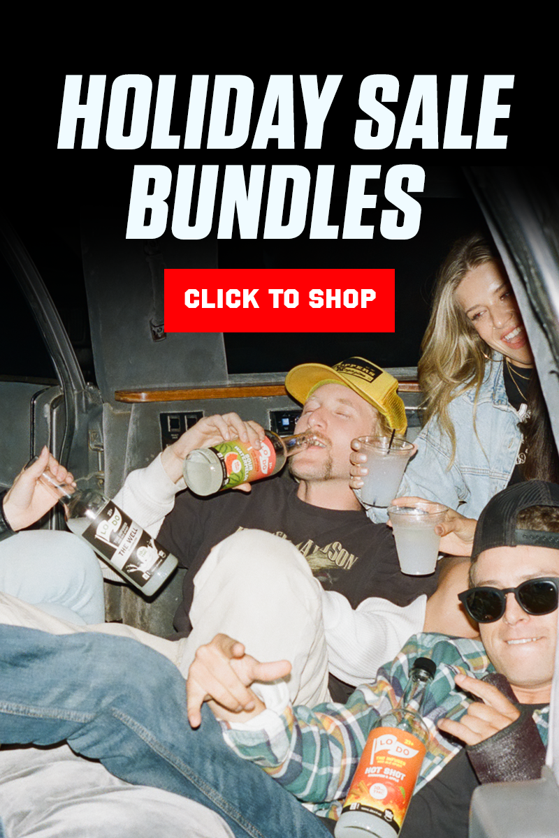 A woman pouring a beverage into a man's mouth with the text 