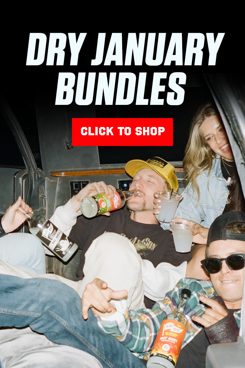 A woman pouring a beverage into a man's mouth with the text 